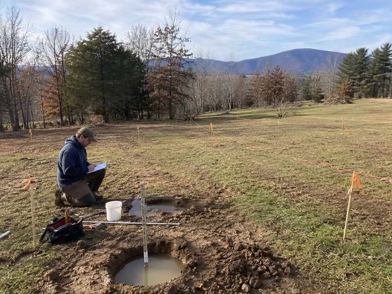 Percolation Test Septic Site Planning Auburn AL | Auburn Land Surveying Percolation test in Auburn AL evaluating soil drainage and septic site planning on an undeveloped property.